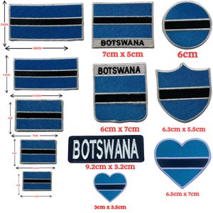 May include: A collection of embroidered patches featuring the Botswana flag design in blue, black, and white. Shapes include rectangles, circles, shields, and hearts. Some patches include the text BOTSWANA. Sizes range from 2cm to 18cm.