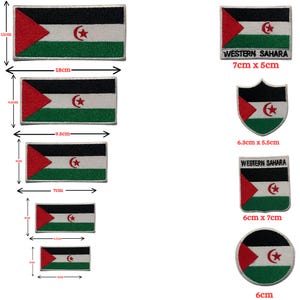 May include: A collection of embroidered patches featuring the Western Sahara flag in various shapes and sizes, including rectangular, shield, and circular designs. Each patch displays a red triangle, black, white, and green stripes, and a red star and crescent.