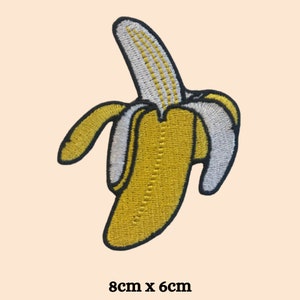 May include: Embroidered patch of a peeled banana. The banana is yellow with a white and yellow interior. The patch measures 8cm x 6cm.