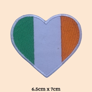 May include: A heart-shaped patch with the colors of the Irish flag: green, white, and orange. The patch is 6.5 inches by 7 inches.