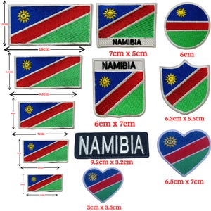May include: A collection of embroidered patches featuring the flag of Namibia in various shapes and sizes, including rectangles, circles, shields, and hearts. Some patches include the text NAMIBIA, with dimensions ranging from 3 cm to 18 cm.