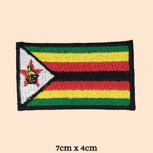 May include: An embroidered patch of the Zimbabwean flag. The flag is green, yellow, red, black, and white with a red star and a black stylized hand in the top left corner. The patch is 7 cm by 4 cm.