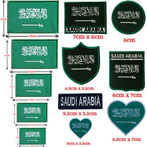 May include: A collection of green and white embroidered patches featuring the Saudi Arabia flag design in various shapes including rectangles, circles, shields, and hearts, with some patches displaying the text SAUDI ARABIA and visible metric dimensions.
