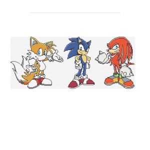 Pode incluir: Uma ilustração de desenho animado de três personagens de videogame: Sonic the Hedgehog, Tails e Knuckles. Sonic é azul com sapatos vermelhos, Tails é laranja e branco com duas caudas, e Knuckles é vermelho com luvas brancas.