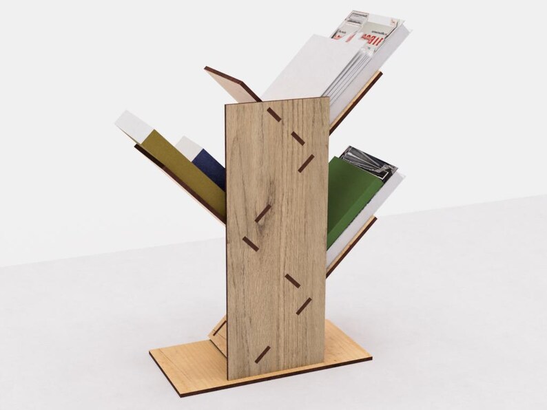 May include: A wooden magazine rack with a tree branch design. The rack has three shelves and is made of light brown wood with dark brown accents. The shelves are angled to hold magazines and books.