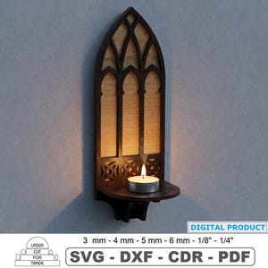 May include: A dark brown laser-cut wooden wall sconce featuring a pointed gothic arch design with a small shelf holding a lit tea light candle. The text reads DIGITAL PRODUCT, 3 mm - 4 mm - 5 mm - 6 mm - 1/8" - 1/4", SVG - DXF - CDR - PDF.