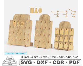 May include: Three wooden earring display stands with various sized holes and shapes for hanging earrings. The stands are made of light brown wood and have a rustic look. The stands are labelled with the text "3 mm - 4 mm - 5 mm - 6 mm - 1/8" - 1/6" - 1/4" and "SVG - DXF - CDR - PDF".