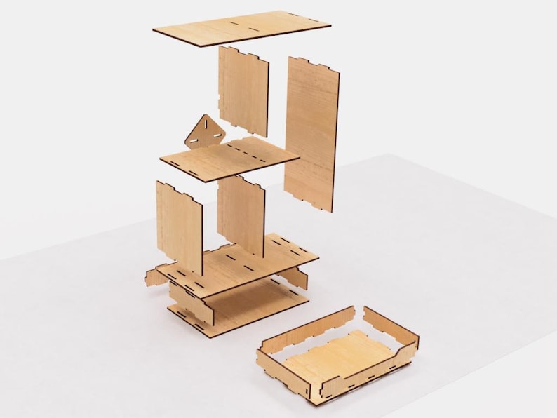 May include: A disassembled wooden shelf unit with six pieces, including a base, three shelves, and two side panels. The shelves are stacked on top of each other, and the side panels are attached to the shelves. The base is a rectangular piece of wood with a small triangular piece attached to the front. The shelves are all the same size and shape, and the side panels are also the same size and shape. The shelf unit is made of light-colored wood.