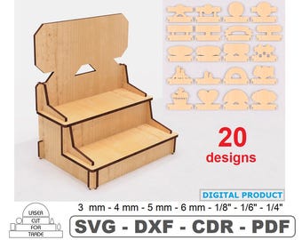 May include: A three-tiered wooden display stand with a back panel. The stand is made of light brown wood with a dark brown border. The stand is 20 designs, 3 mm - 4 mm - 5 mm - 6 mm - 1/8" - 1/6" - 1/4" SVG - DXF - CDR - PDF.