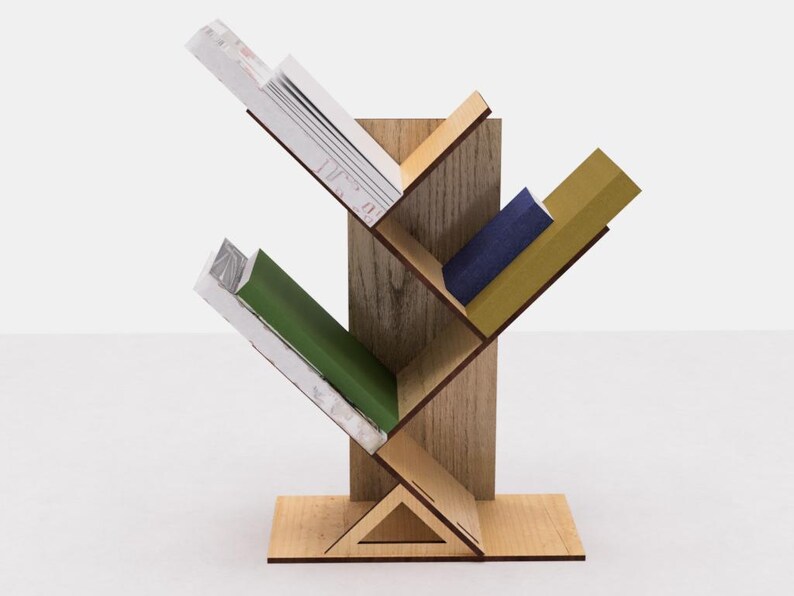 May include: A wooden bookshelf shaped like a tree with four shelves. The shelves are filled with books of different colors and sizes. The bookshelf is made of light brown wood and has a triangular base.