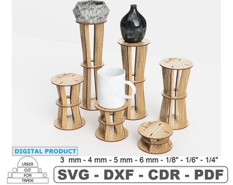 Può includere: Set di cinque espositori in legno di diverse altezze. Gli espositori sono in legno marrone chiaro e hanno un design semplice e moderno. Gli espositori sono perfetti per esporre piccoli oggetti, come piante, vasi o candele. 3 mm - 4 mm - 5 mm - 6 mm - 1/8" - 1/6" - 1/4" SVG - DXF - CDR - PDF