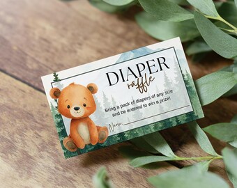 May include: A diaper raffle card featuring a watercolor illustration of a brown bear cub. The card has the text "DIAPER raffle" and instructions to bring diapers for a prize. The background includes a forest scene.