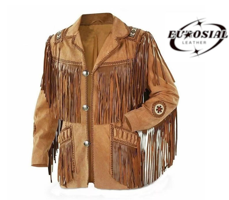 May include: A tan suede jacket with long fringe detailing on the sleeves, chest, and pockets. The jacket has decorative stitching and silver buttons. The brand name "EUROSIAL LEATHER" is printed on the upper right corner.