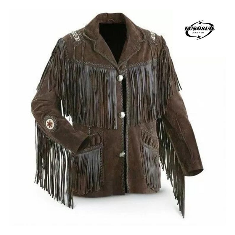 May include: Brown suede jacket with fringe detailing. The jacket features a notched collar, silver buttons, and decorative beading on the shoulders and sleeves. The jacket has two front pockets and the brand logo "EUROSIAI LEATHER" in the upper right corner.