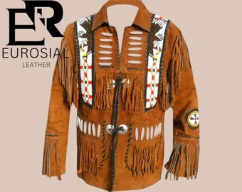 May include: Brown suede leather jacket with fringe detailing and decorative beadwork. The jacket features a collared neckline, long sleeves, and a button-up front. The sleeves and front have fringe. The jacket has the text "EUROSIA LEATHER".