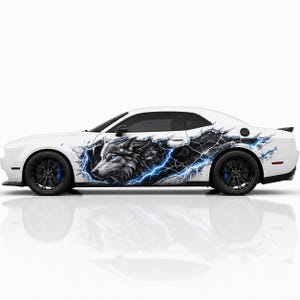 May include: A white two-door coupe featuring a large side decal of a wolf head with glowing blue eyes, surrounded by a black cracked-surface effect and bright blue lightning bolts. The vehicle has black wheels and blue brake calipers.