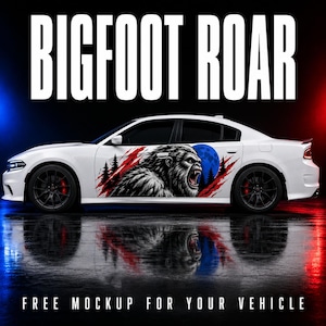 May include: A white sedan featuring a large graphic decal on the side panel depicting a roaring Bigfoot, pine trees, red claw marks, and a blue moon. The text BIGFOOT ROAR is displayed in large white letters above the vehicle against a dark background.