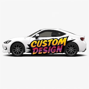 May include: A white sports car viewed from the side, featuring dark gray multi-spoke wheels and a large graphic on the door that reads CUSTOM DESIGN in bold, yellow and orange gradient lettering with a dark purple shadow effect.