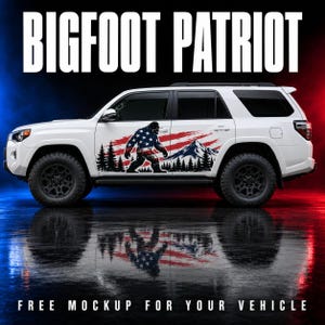 May include: A white SUV featuring a large side decal of a Bigfoot silhouette filled with an American flag pattern, set against a backdrop of black pine trees and a mountain peak. The text BIGFOOT PATRIOT appears in large white letters above the vehicle.