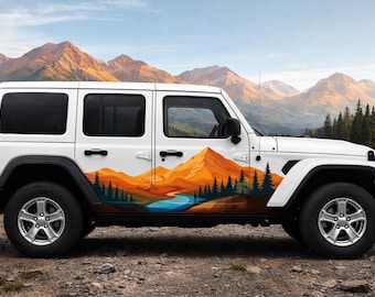 May include: White SUV with a mountain landscape graphic on the side. The design features orange and yellow mountains, green trees, and a blue river. The background shows a mountain range under a blue sky.
