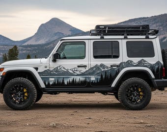 May include: White SUV with black wheels and a mountain-themed graphic on the side. The vehicle has a roof rack with a black storage container and a spare tire mounted on the back. The wheels have yellow brake calipers.