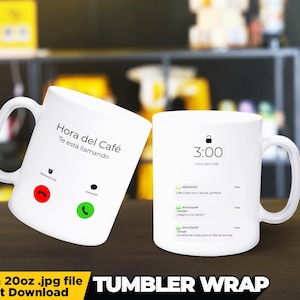 May include: Two white ceramic mugs with a coffee-themed design. The mug on the left has a phone icon with the text "Hora del Cafe Te esta llamando". The mug on the right has a lock icon and the text "3:00 Hora del Cafe".