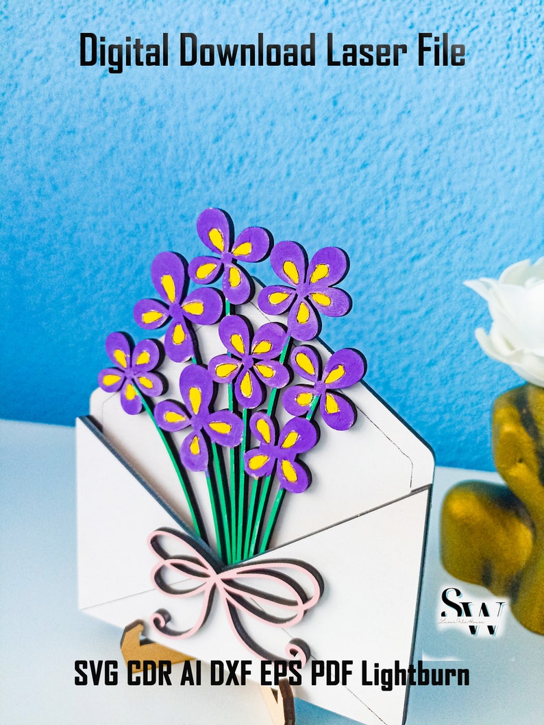 May include: A white envelope cutout featuring a bouquet of purple flowers with yellow centers and green stems, tied with a light pink bow. The text Digital Download Laser File and SVG CDR AI DXF EPS PDF Lightburn is visible on the image.