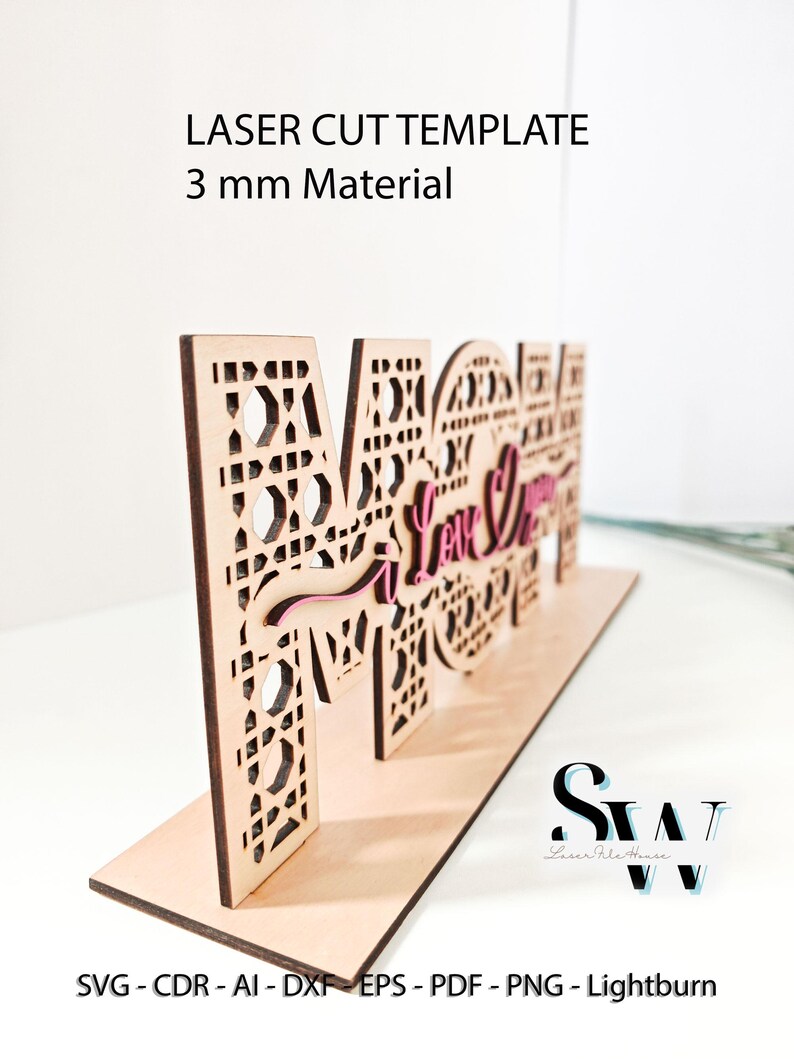 May include: A laser cut wooden sign spelling MOM with intricate geometric patterns and the script text I Love You in pink. The sign is designed for 3 mm material and includes file formats SVG, CDR, AI, DXF, EPS, PDF, PNG, and Lightburn.
