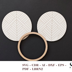 May include: Two circular white wooden coasters featuring a black geometric herringbone pattern and one plain circular wooden ring. The text SVG - CDR - AI - DXF - EPS - PDF - LBRN2 is displayed at the bottom of the image along with a logo.