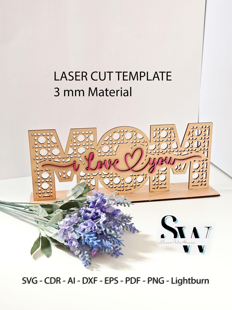 May include: A laser-cut wooden sign featuring the word MOM with a cane webbing pattern, overlaid with the pink script text I Love You. The sign is designed for 3 mm material and includes file formats SVG, CDR, AI, DXF, EPS, PDF, PNG, and Lightburn.
