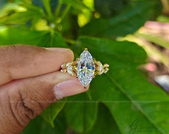 Verlobungsring mit Marquise-Moissanit, florale Fassung aus 14-karätigem Gold