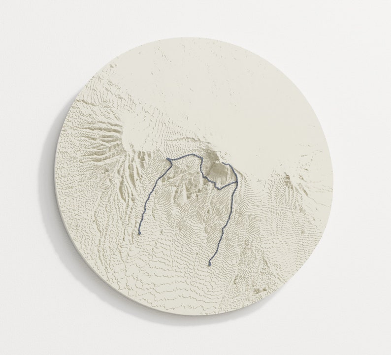 Circle outline, beige colour variant hangs on wall, the trail is dark blue grey.