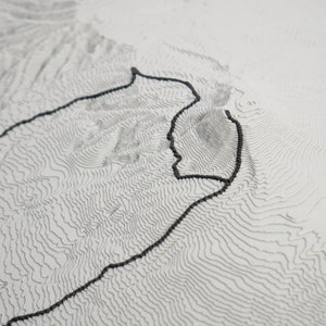 Closeup detail shot of trail showcasing matte grey material and 3D printed layers. Topographic detail can be seen clearly.