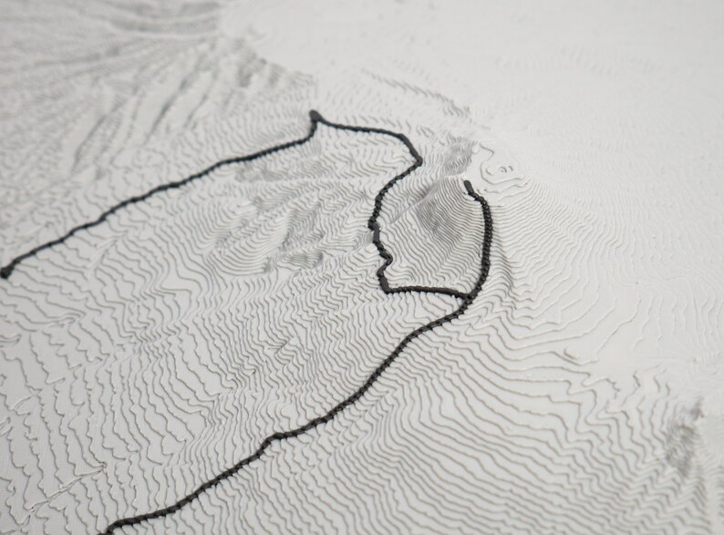 Closeup detail shot of trail showcasing matte grey material and 3D printed layers. Topographic detail can be seen clearly.