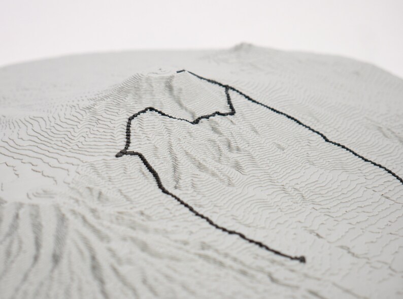 Closeup detail shot trail section showcasing matte grey material and 3D printed layers. Topographic detail can be seen clearly.