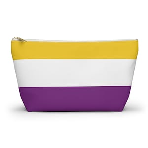 May include: A yellow, white, and purple striped zippered pouch. The pouch is made of a soft, durable fabric and is perfect for carrying small items.