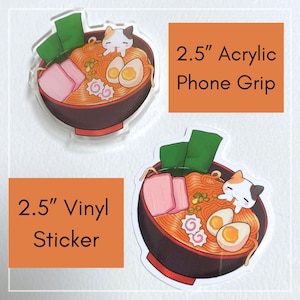 May include: A 2.5" acrylic phone grip and a 2.5" vinyl sticker featuring a colorful illustration of a bowl of ramen. The ramen includes noodles, eggs, pork, seaweed, and a small cat.