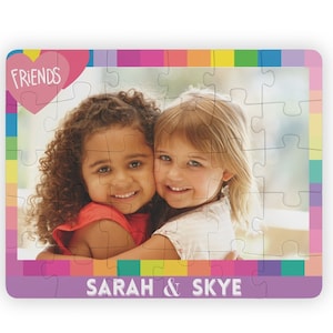 Colorful Custom photo puzzle with personalized name at  bottom. Girl Puzzle has a pink heart with  word friends in top left.