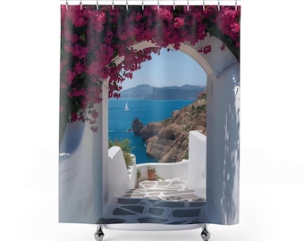 May include: A shower curtain featuring a printed scene of a white arched doorway framed by vibrant pink bougainvillea flowers. The view through the arch reveals a stone staircase leading down toward a blue sea with cliffs and a small sailboat.