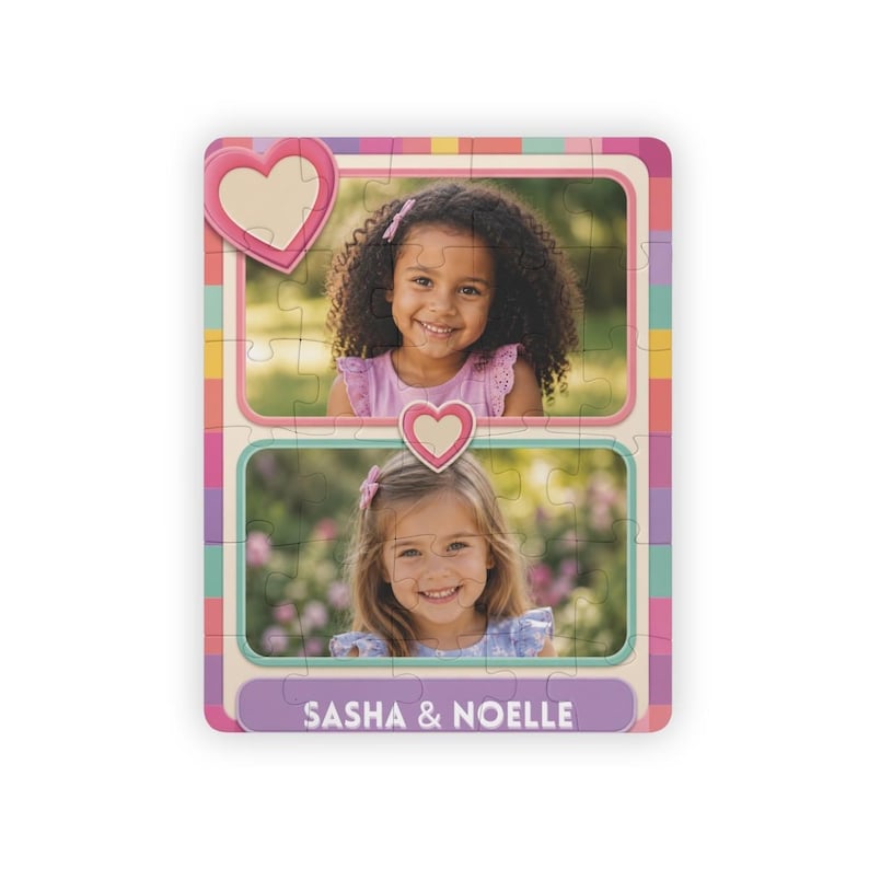 May include: A rectangular jigsaw puzzle featuring two separate portrait photographs of young children, each framed by a pink border with heart accents. The puzzle has a colorful checkered border and the text "SASHA & NOELLE" printed in white.