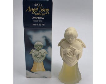 Profumo vintage AVON Angel Song With Lyre Charisma, nuovo, mai usato.