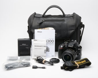 Nikon D3300 DSLR w/18-55mm f3.5-5.6 zoom, case, batt+charger+manuals ~16K acts