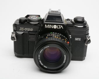 Minolta X700 35mm SLR w/50mm f1.7 lens, strap, cap, UV, new seals, Nice