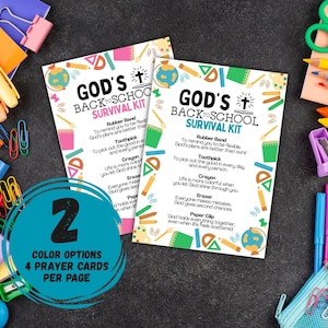 May include: Two printed cards with the text "GOD'S BACK TO SCHOOL SURVIVAL KIT" surrounded by school-themed illustrations. The cards are on a dark surface with colorful school supplies like crayons, pencils, and paper clips. The cards have a teal circle with the text "2 COLOR OPTIONS 4 PRAYER CARDS PER PAGE".