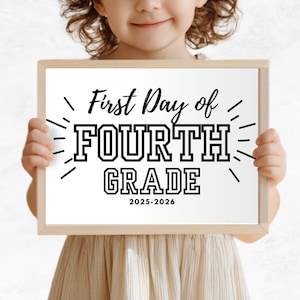 May include: A wooden framed sign held by a child. The sign reads "First Day of FOURTH GRADE 2025-2026" in black text with a decorative burst design. The background is a soft, neutral color.