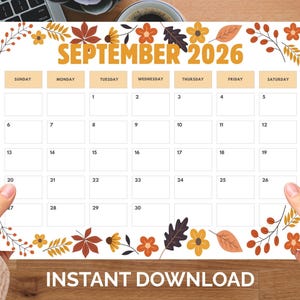 May include: A September 2026 calendar page featuring a white background with a grid layout for days of the month. The top and bottom borders are decorated with colorful autumn-themed illustrations of orange flowers, brown oak leaves, and berries.