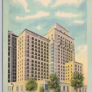 May include: A vintage postcard depicting Abbott Hall at Northwestern University in Chicago. The building is a large, multi-story structure with many windows. The postcard is in color and shows a blue sky with white clouds.