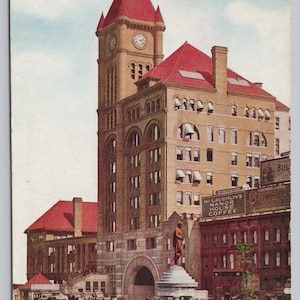 May include: Vintage postcard featuring the Illinois Central Depot in Chicago. The image shows a large building with a clock tower and red roof, with horse-drawn carriages in front. The text "ILLINOIS CENTRAL DEPOT, CHICAGO" is at the bottom.