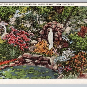 May include: A handmade, ceramic mug with a speckled, cream-colored glaze. The mug features a wide, rounded body and a sturdy handle. The interior is a darker, earthy tone. The mug is suitable for hot or cold beverages.