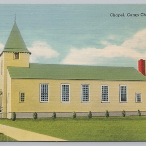 May include: Vintage postcard featuring a yellow chapel with a green roof and steeple. The chapel has multiple windows and a red chimney. The text "Chapel, Camp Chaffee, Ark." is visible. The postcard has a light blue sky with clouds and a green lawn.